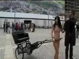 Naked babe pulling rickshaw in the streets