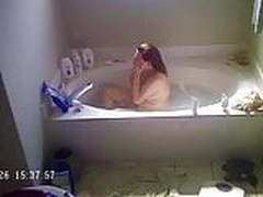 Sexy wife relaxing in bath and drying off 