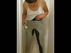 Pissing in her trousers and stripping naked