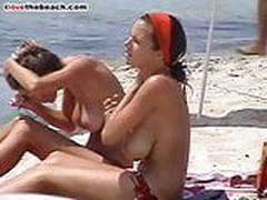 2 busty young girls oil their boobs on the beach HD | xvideosearch.com