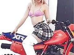 Dove Cameron in a pink bra straddling a motorcycle Free XXX | xvideosearch.com