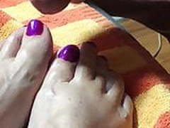 Purple painted toes with cum