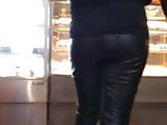 Girl in leather pants at the mall