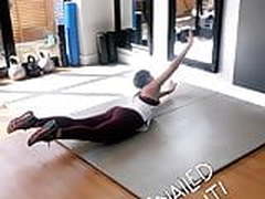 Frankie Bridge working out on the floor
